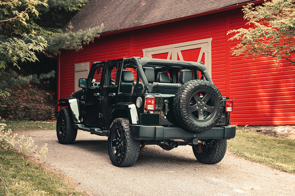 Corsa Performance 2.75 Inch Cat-Back Dual Rear Exit with Single 4.0 Inch Black PVD Flat Cut Tips with USA Flag Etch 07-18 Jeep Wrangler JKU 116 Inch Wheel Base (21122BLKUSA)