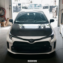 Load image into Gallery viewer, Seibon 2023 Toyota GR Corolla OE-Style Carbon Fiber Hood - Gloss Finish (HD23TYGRCOR-OE)