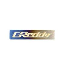 Load image into Gallery viewer, GReddy Titanium Emblem - (70 x15mm) (18000203)