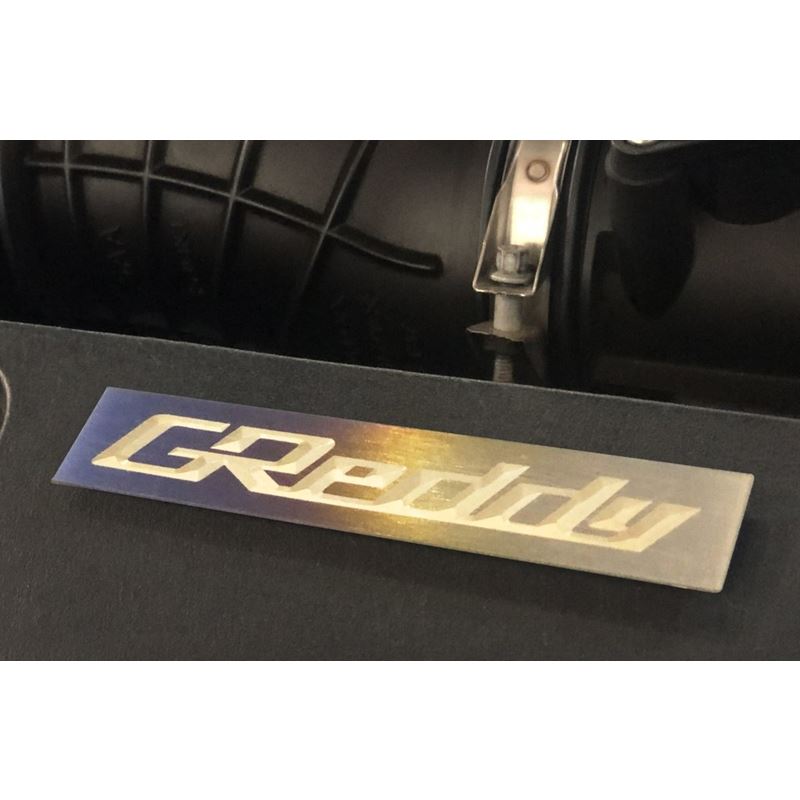 GReddy Titanium Emblem - (105x20mm) (18000201)